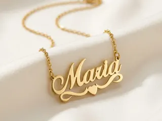 Name Necklaces — Bin Maqsood Maria script name necklace on soft ivory silk.