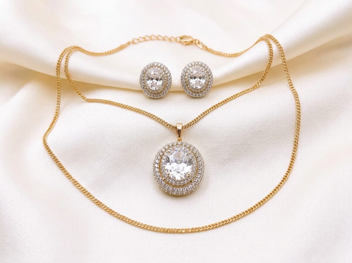 Bin Maqsood oval halo pendant and earring set with bright centre stone.