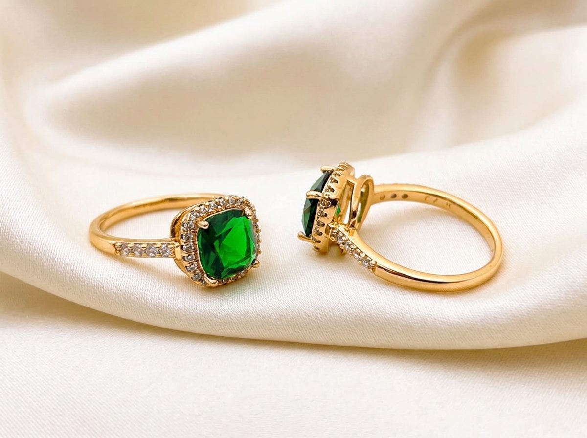 Bin Maqsood emerald-style halo ring on ivory silk.